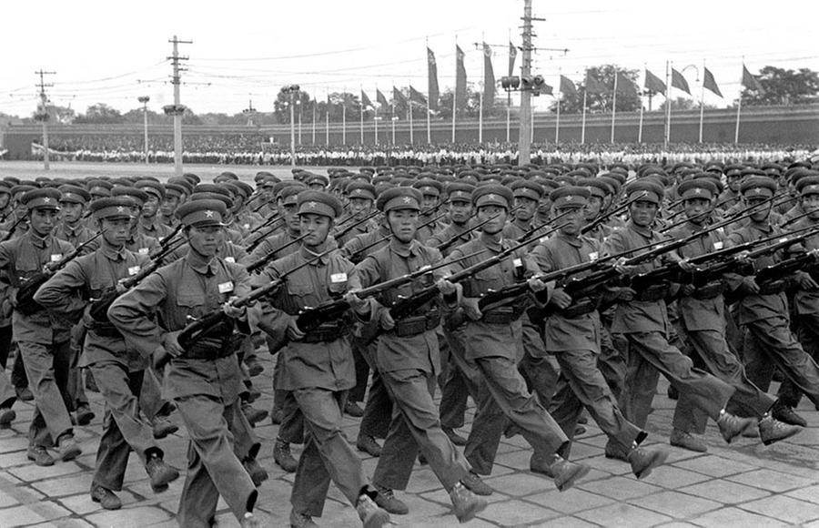 infantry passes the gate tower of tian"anmen square in 1954.