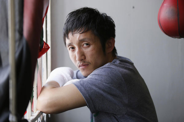 Two-time Olympic gold medalist and three-time world amateur boxing champion Zou Shiming of China poses for a portrait at Wild Card Boxing Club while working out for his upcoming professional boxing debut, in Los Angeles, March 20, 2013. 