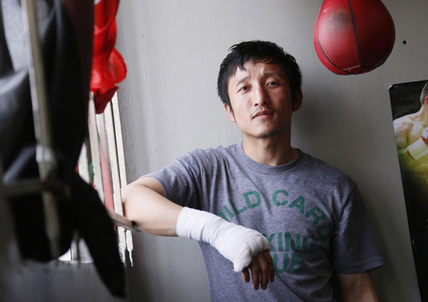 Two-time Olympic gold medalist and three-time world amateur boxing champion Zou Shiming of China poses for a portrait at Wild Card Boxing Club while working out for his upcoming professional boxing debut, in Los Angeles, March 20, 2013. 