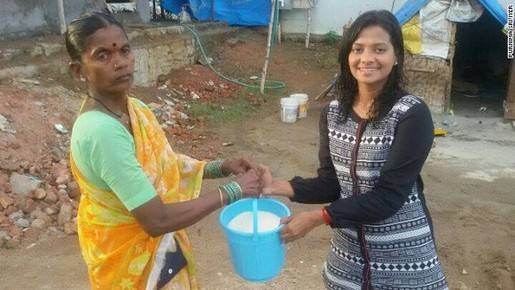 Purnima Sri Iye (right), a journalist at Metro India, is among the first to donate rice as part of the Rice Bucket Challenge.