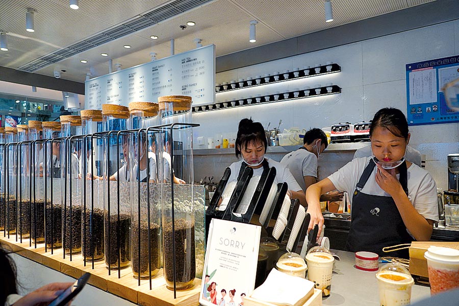 staff from   heytea shop in shanghai prepare drinks.