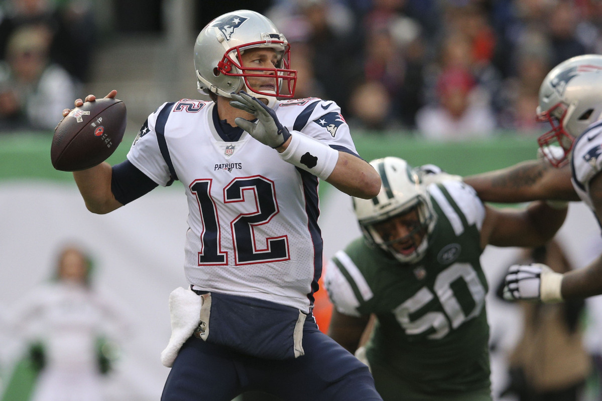 New England Patriots Tom Brady throws a pass in the first half against the  New York Jets in week 12 of the NFL at MetLife Stadium in East Rutherford,  New Jersey on