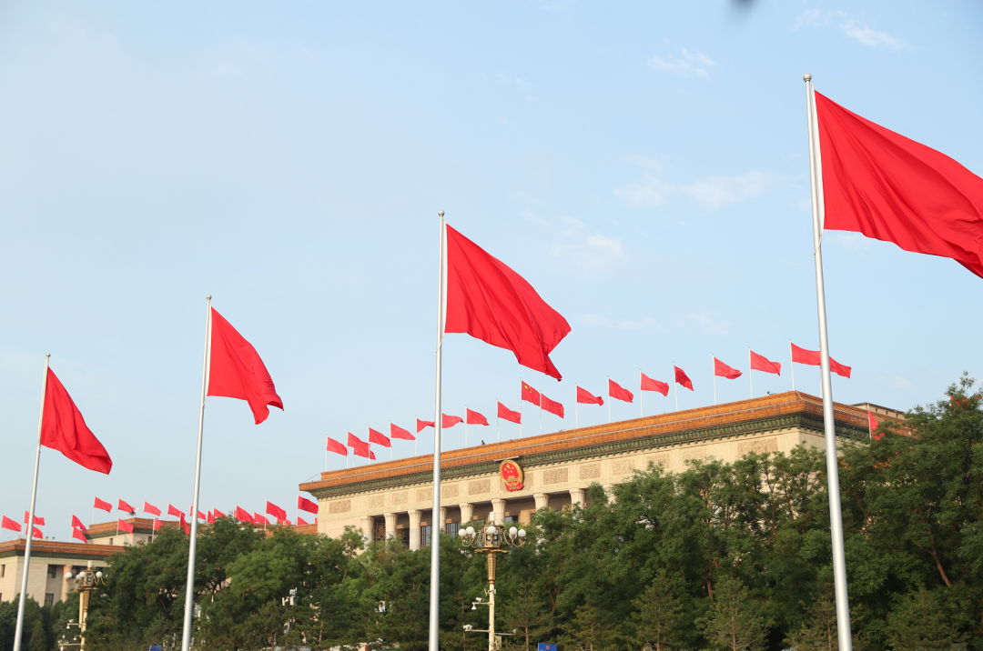 flags fly on the tian"anmen square and atop the great hall of