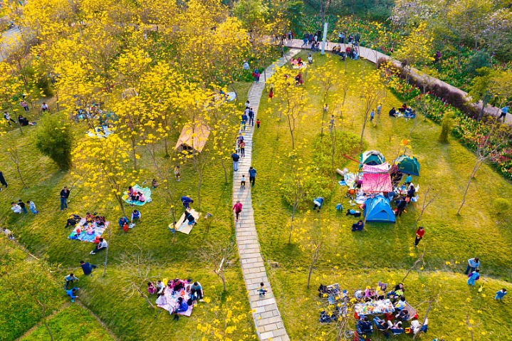 YANTAI, CHINA - MAY 7, 2023 - Tourists relax at a campsite in