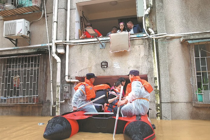 Heavy rains and flooding in southern China threaten millions as rescuers evacuate residents