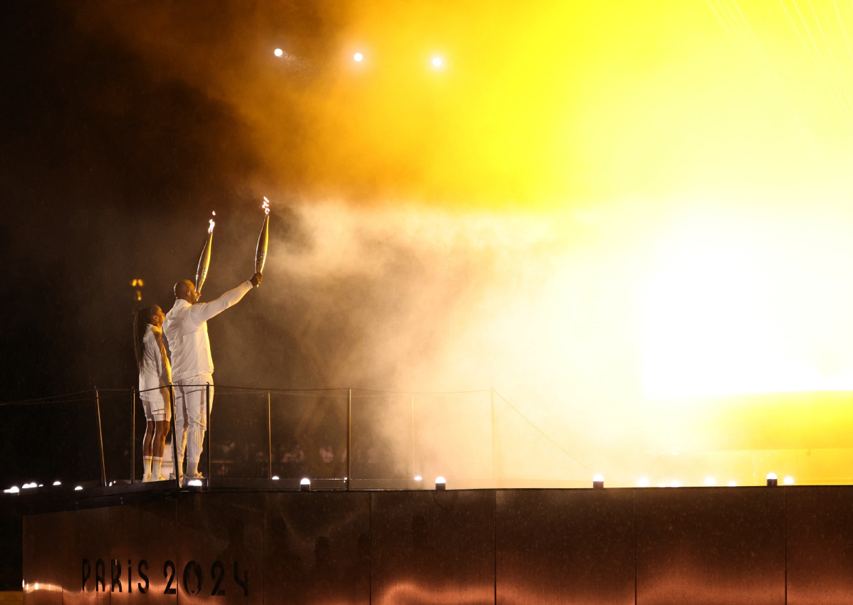 Teddy Riner, MarieJose Perec light Olympic cauldron as Paris Games