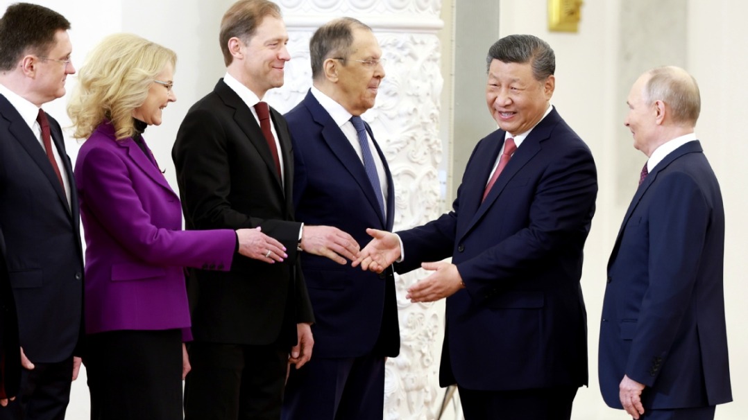 Xi attends welcome ceremony held by Putin