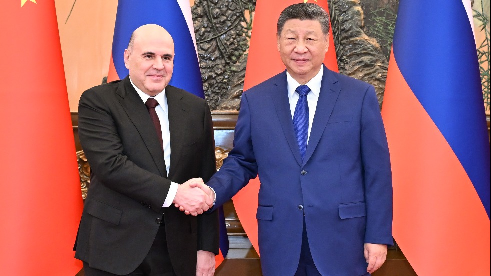 Xi meets Russian PM in Beijing