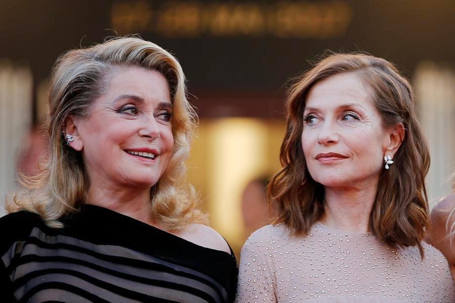 Actress Catherine Deneuve and actress Isabelle Huppert pose at the screenin...
