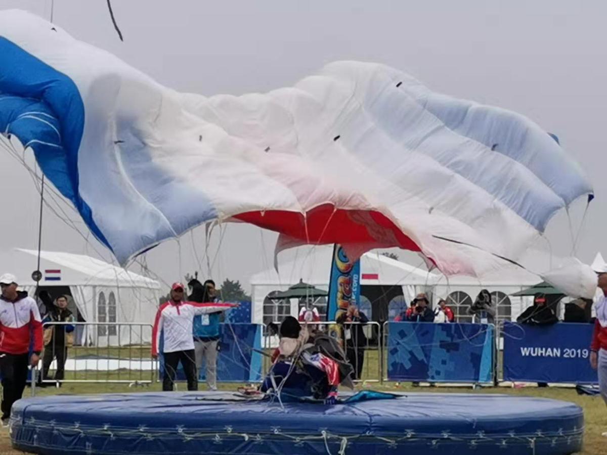 a french parachutist lands during the male team accuracy