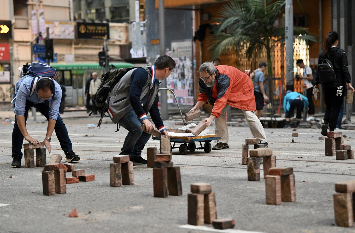 Public clears protest debris left during chaotic weekend