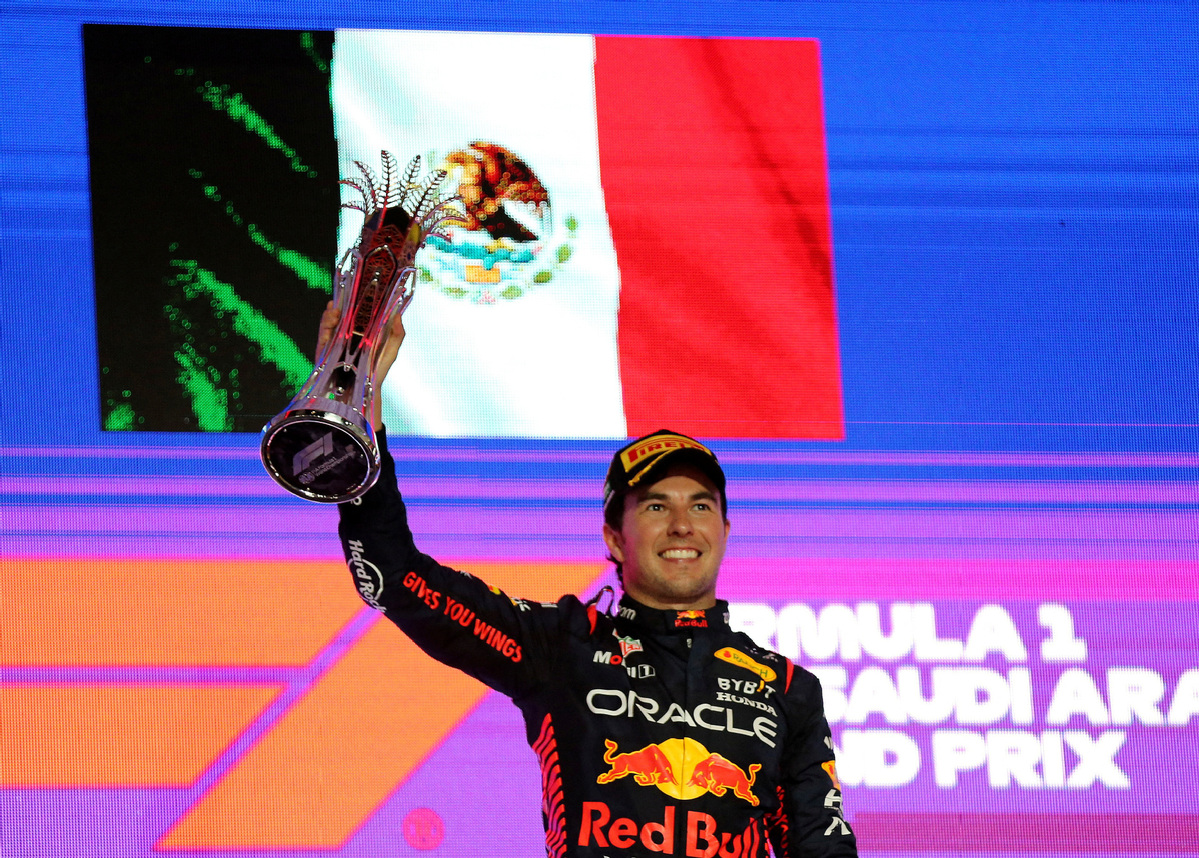 Race winner Pierre Gasly celebrates on the podium with the trophy