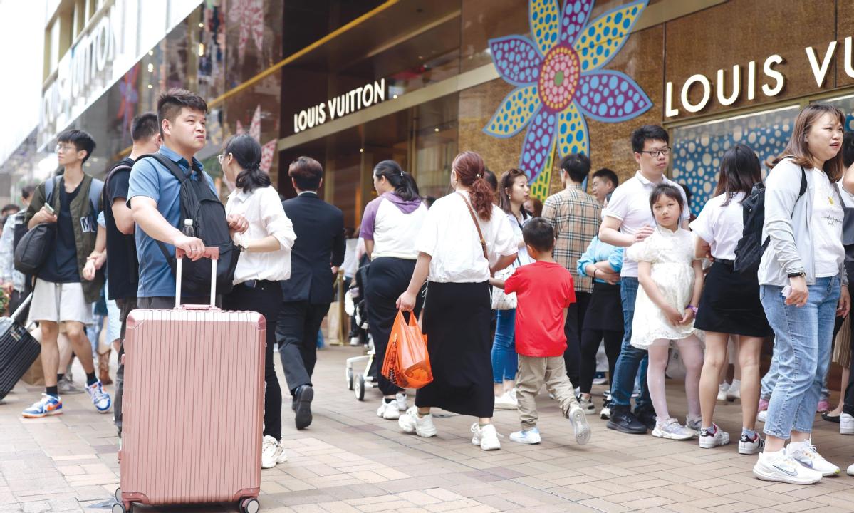 Shoppers Form Long Lines at Louis Vuitton's China Stores as Price
