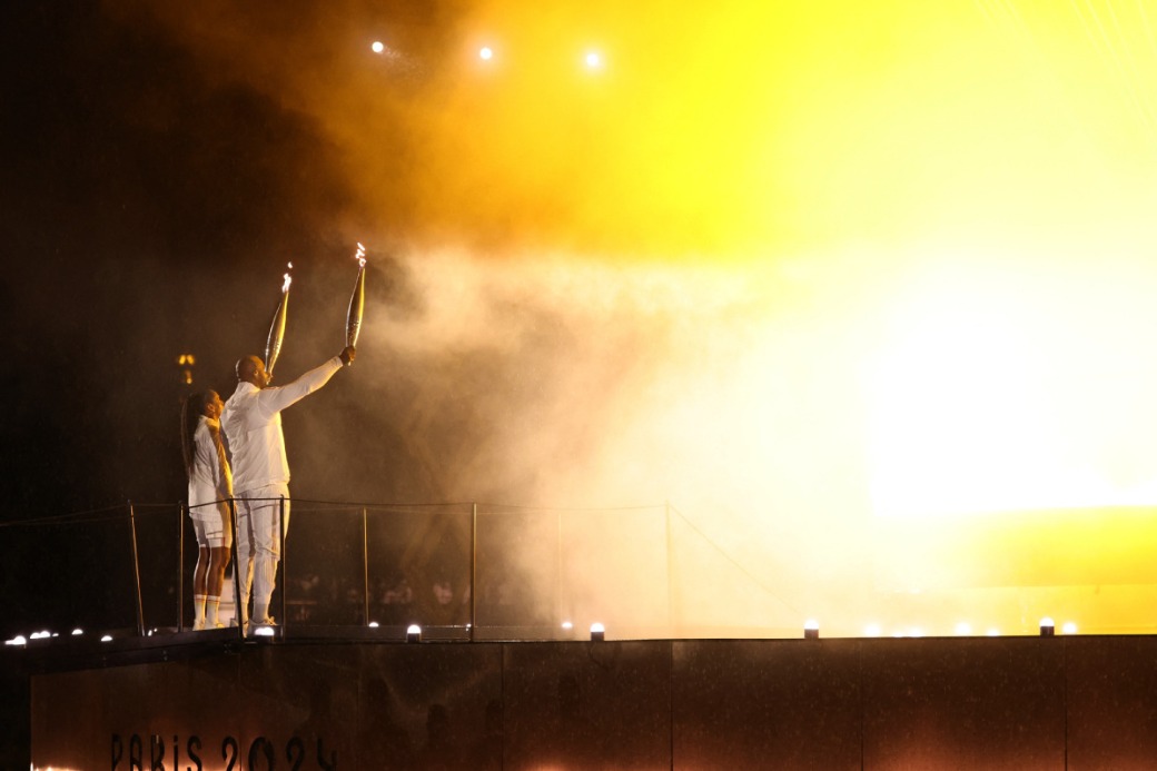 Teddy Riner, Marie-Jose Perec light Olympic cauldron as Paris Games ...