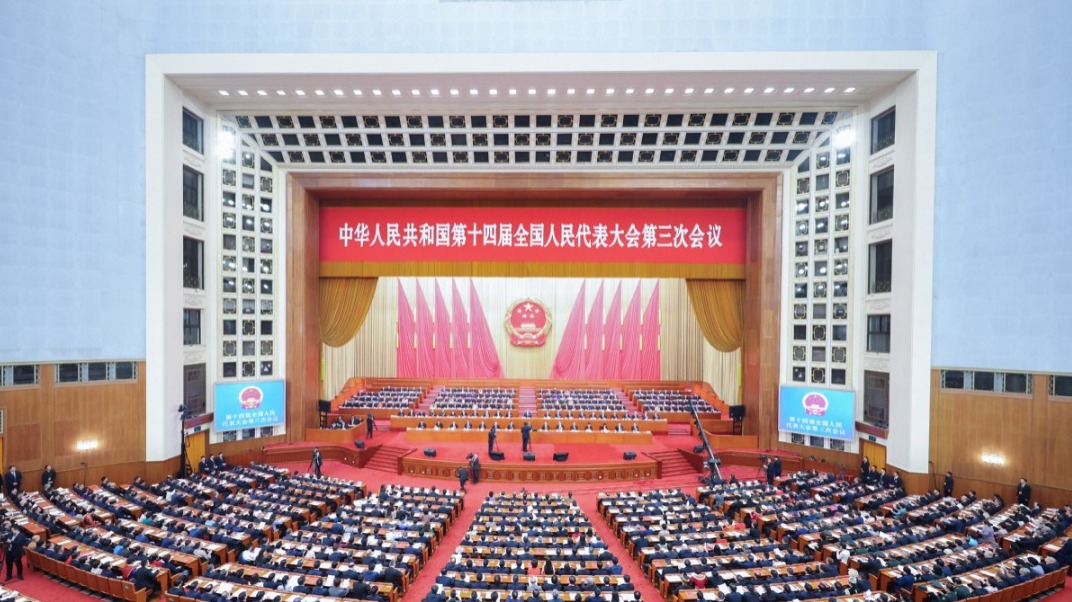 China's national legislature holds closing meeting of annual session