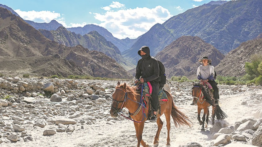 Horseback tours across Xinjiang's lush landscapes draw tourists