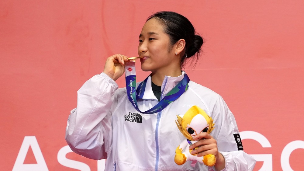 An defends women's singles title, China claims mixed doubles gold in badminton